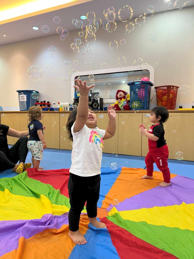 Toddler plays at a weekend class for toddler in KL.