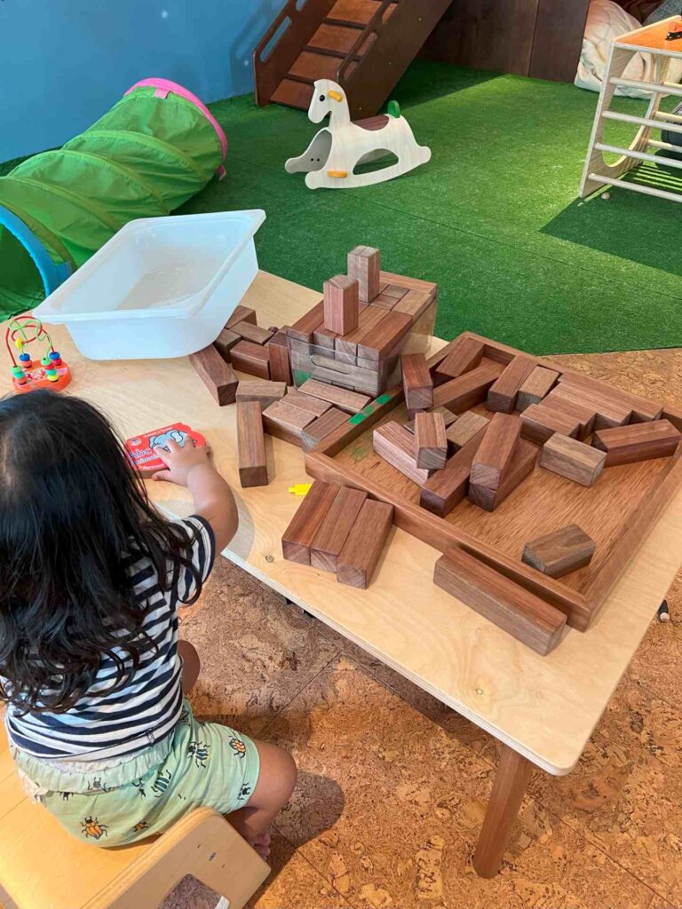 Toddler plays at The Red Beanbag baby friendly cafe KL.