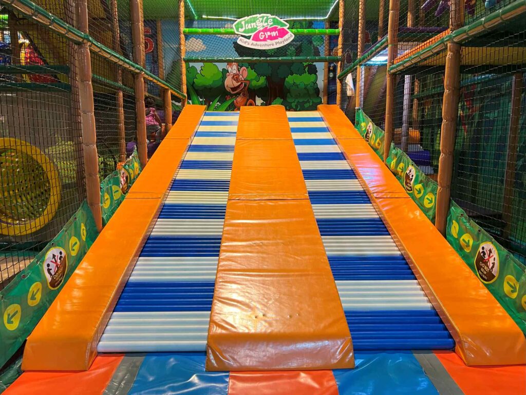 Indoor playground Kuala Lumpur Jungle Gym's roller slides.
